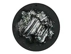 The same particle as seen during the review mode in real color using the U-ANT filter and the color correction mode. The particle is confirmed as metallic.